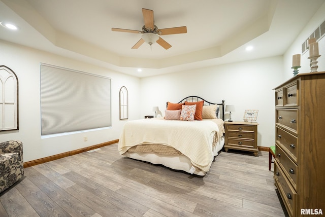 623 Jasper Rd, Centralia, IL 62801 - bedroom featuring a raised ceiling, recessed lighting, light wood finished floors, and a ceiling fan
