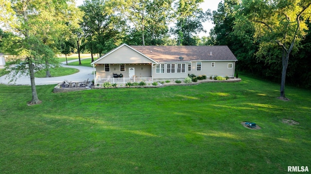 623 Jasper Rd, Centralia, IL 62801 - single story home with a front lawn, covered porch, and view of scattered trees