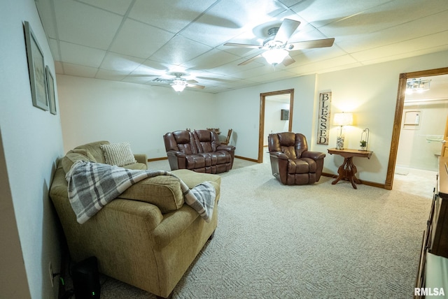 623 Jasper Rd, Centralia, IL 62801 - living room with carpet floors, ceiling fan, and a paneled ceiling