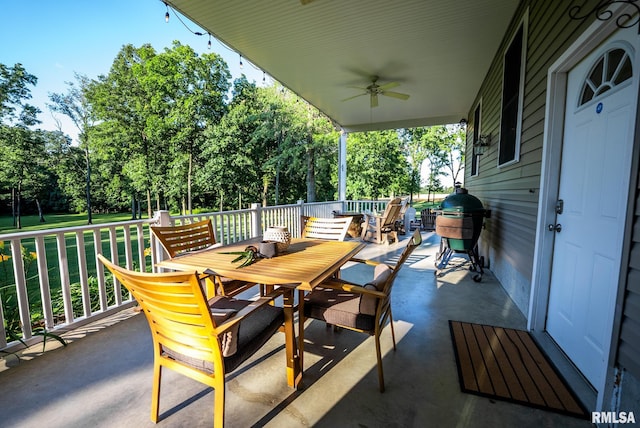623 Jasper Rd, Centralia, IL 62801 - view of patio / terrace featuring outdoor dining area, ceiling fan, view of wooded area, and area for grilling