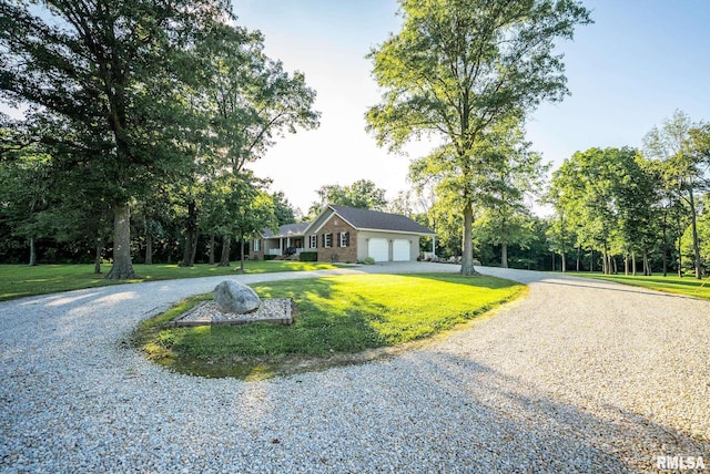 623 Jasper Rd, Centralia, IL 62801 - ranch-style home featuring driveway, a garage, and a front lawn