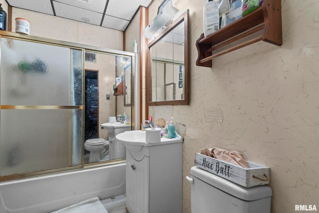 215 N Wilson St, Girard, IL 62640 - bathroom featuring enclosed tub / shower combo, a paneled ceiling, vanity, and wood finished floors