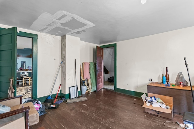 215 N Wilson St, Girard, IL 62640 - below grade area with wood finished floors and baseboards