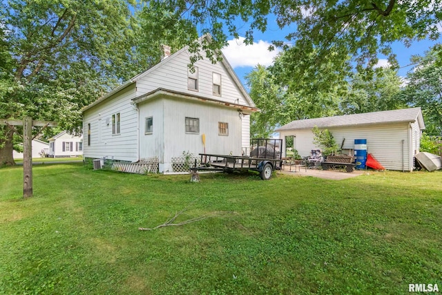 215 N Wilson St, Girard, IL 62640 - rear view of property featuring a lawn and a chimney