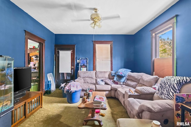 215 N Wilson St, Girard, IL 62640 - carpeted living area featuring a ceiling fan