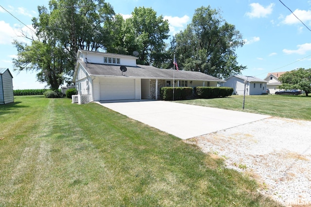 107 E Harrison St, Edinburg, IL 62531 - view of front facade featuring concrete driveway, a garage, and a front yard