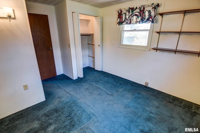 107 E Harrison St, Edinburg, IL 62531 - unfurnished bedroom with dark carpet and ornamental molding