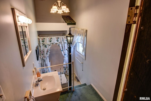 107 E Harrison St, Edinburg, IL 62531 - bathroom featuring a chandelier and vanity