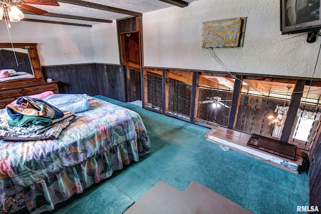 107 E Harrison St, Edinburg, IL 62531 - carpeted bedroom featuring beam ceiling, wooden walls, a textured ceiling, and a wainscoted wall