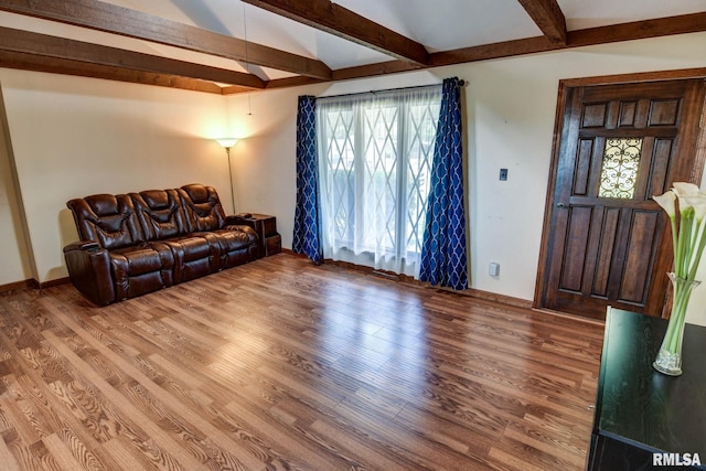 107 E Harrison St, Edinburg, IL 62531 - living room featuring beam ceiling and light wood-style floors