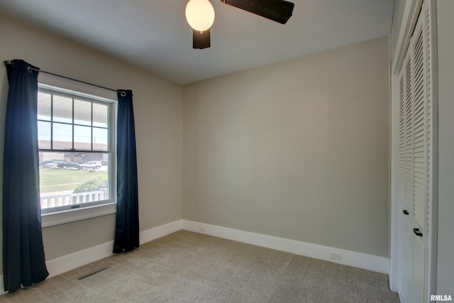 1512 Locust St, Quincy, IL 62301 - empty room featuring light colored carpet and ceiling fan