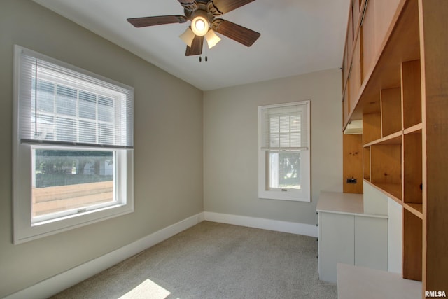 1512 Locust St, Quincy, IL 62301 - spare room featuring light colored carpet and a ceiling fan