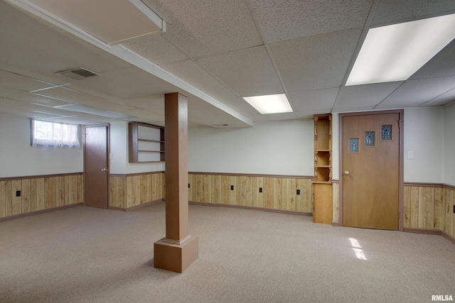 1512 Locust St, Quincy, IL 62301 - basement featuring wooden walls, a wainscoted wall, a paneled ceiling, and carpet flooring