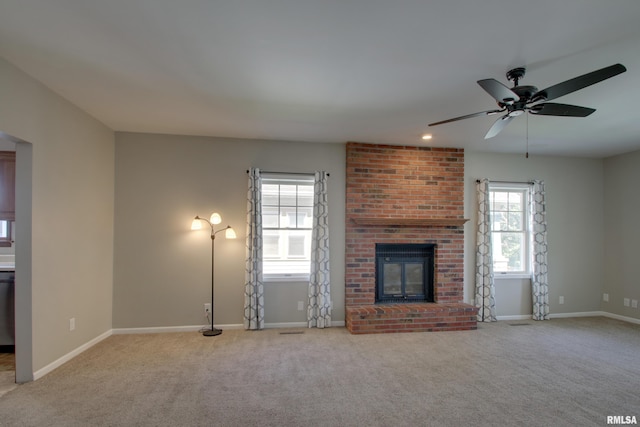 1512 Locust St, Quincy, IL 62301 - unfurnished living room featuring plenty of natural light, carpet floors, and a ceiling fan