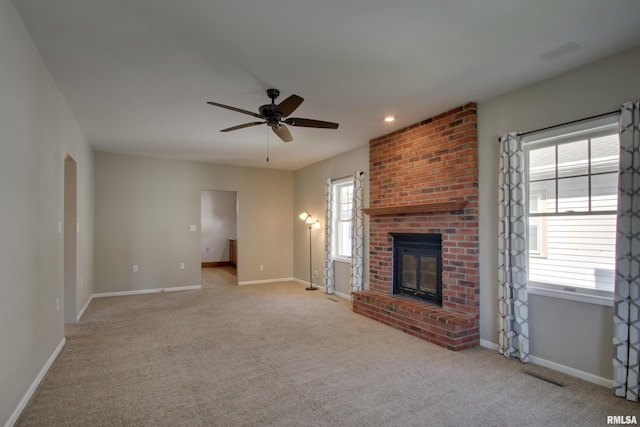 1512 Locust St, Quincy, IL 62301 - unfurnished living room featuring a ceiling fan, carpet, plenty of natural light, and recessed lighting
