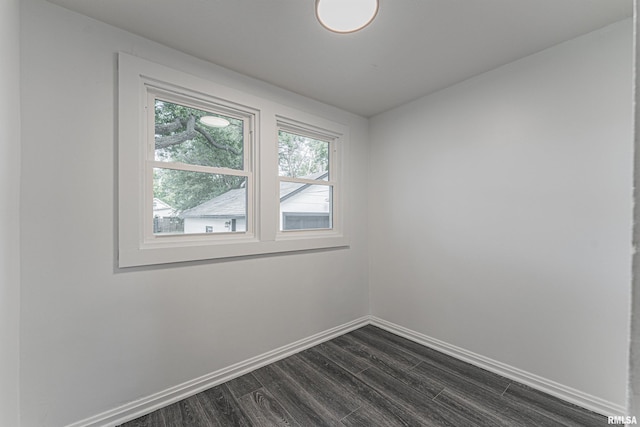 914 Pekin St, Lincoln, IL 62656 - spare room with baseboards and dark wood finished floors