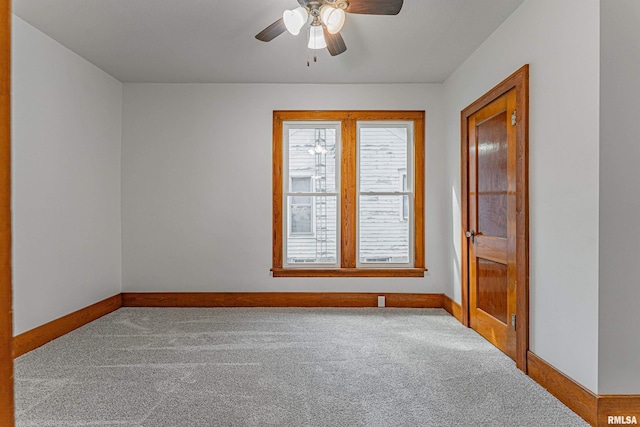 914 Pekin St, Lincoln, IL 62656 - empty room featuring carpet floors and a ceiling fan