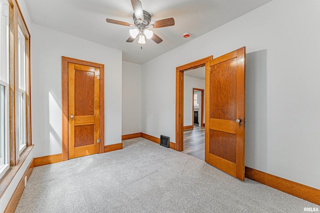914 Pekin St, Lincoln, IL 62656 - carpeted spare room with ceiling fan and a smoke detector