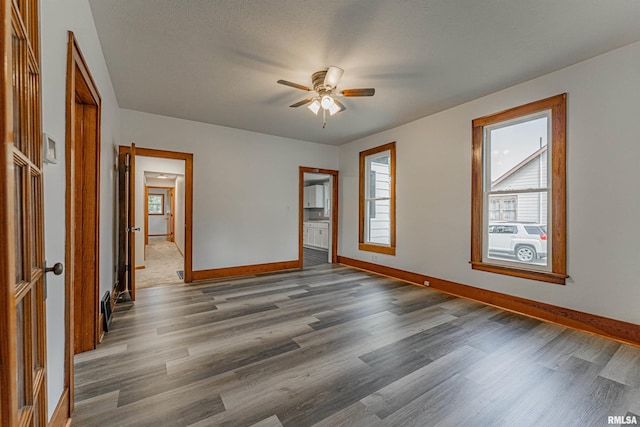 914 Pekin St, Lincoln, IL 62656 - unfurnished room with ceiling fan and wood finished floors