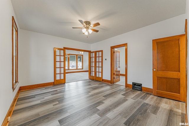 914 Pekin St, Lincoln, IL 62656 - spare room with french doors, ceiling fan, and wood finished floors