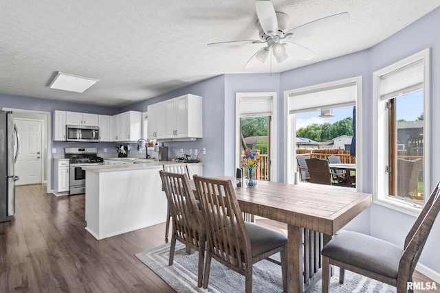 504 Windamere Dr, Sherman, IL 62684 - dining space featuring dark wood-style flooring, a textured ceiling, and a ceiling fan