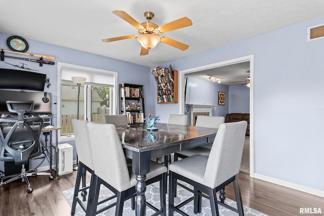504 Windamere Dr, Sherman, IL 62684 - dining space with wood finished floors and ceiling fan