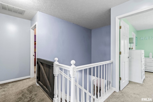 504 Windamere Dr, Sherman, IL 62684 - hall with carpet, an upstairs landing, and a textured ceiling