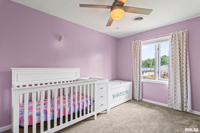 504 Windamere Dr, Sherman, IL 62684 - carpeted bedroom with a nursery area and a ceiling fan