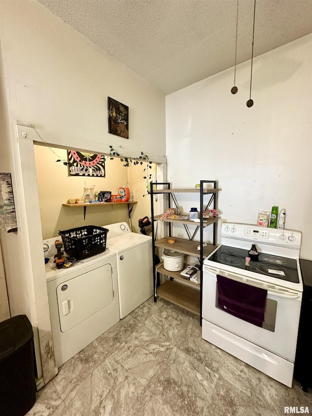 311 Main St, Meredosia, IL 62665 - kitchen featuring white range with electric cooktop, washer and clothes dryer, and a textured ceiling