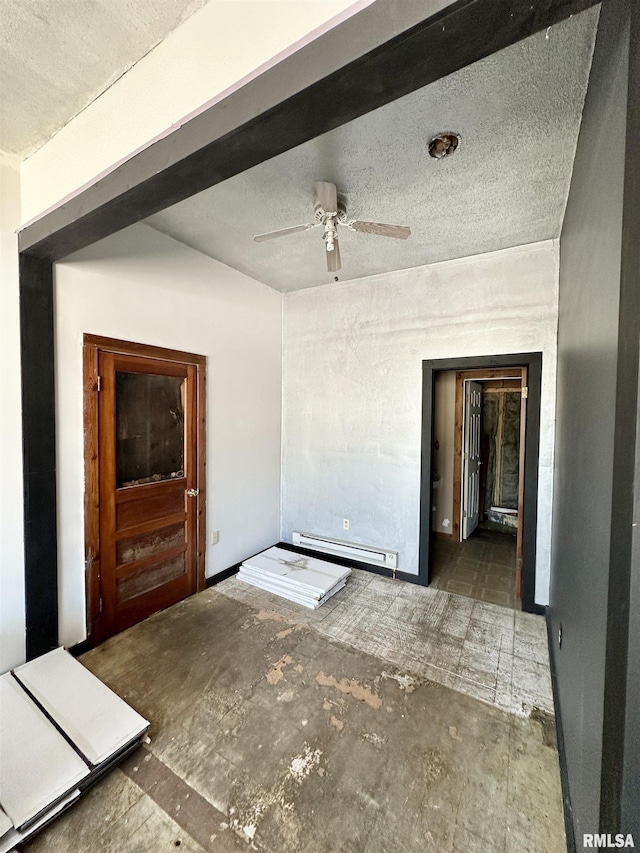 311 Main St, Meredosia, IL 62665 - empty room with baseboard heating, a textured ceiling, and ceiling fan
