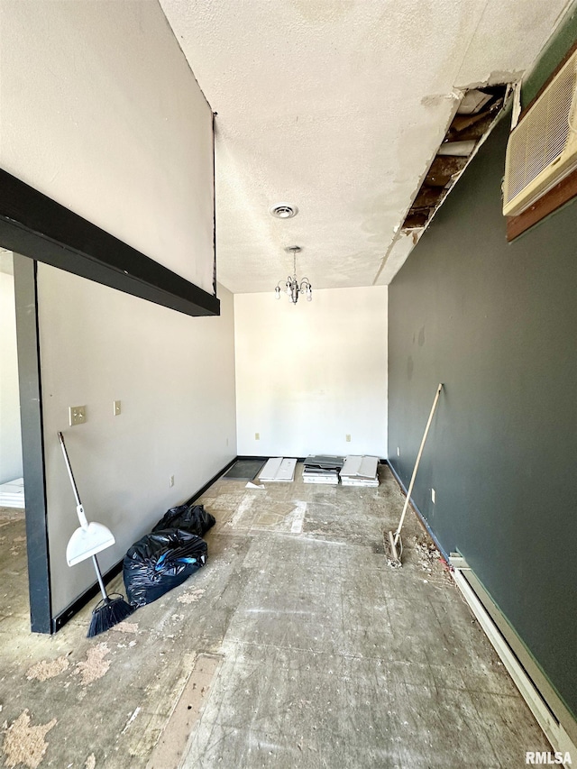 311 Main St, Meredosia, IL 62665 - unfurnished room with a baseboard heating unit and a textured ceiling