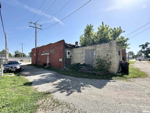 311 Main St, Meredosia, IL 62665 - view of side of property with cooling unit and concrete block siding