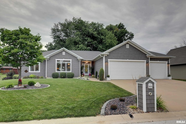 3005 Helens Ct, Quincy, IL 62305 - ranch-style house featuring a front yard, concrete driveway, and an attached garage