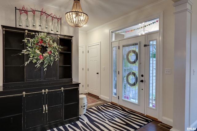 3005 Helens Ct, Quincy, IL 62305 - foyer featuring a chandelier, ornamental molding, and wood finished floors