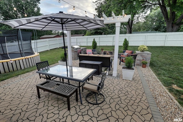 3005 Helens Ct, Quincy, IL 62305 - fenced backyard featuring a trampoline, a patio area, outdoor dining area, and an outdoor hangout area
