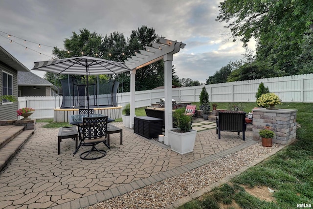 3005 Helens Ct, Quincy, IL 62305 - fenced backyard featuring a trampoline and a patio area