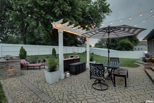 3005 Helens Ct, Quincy, IL 62305 - fenced backyard featuring a patio, a pergola, outdoor dining space, and an outdoor kitchen