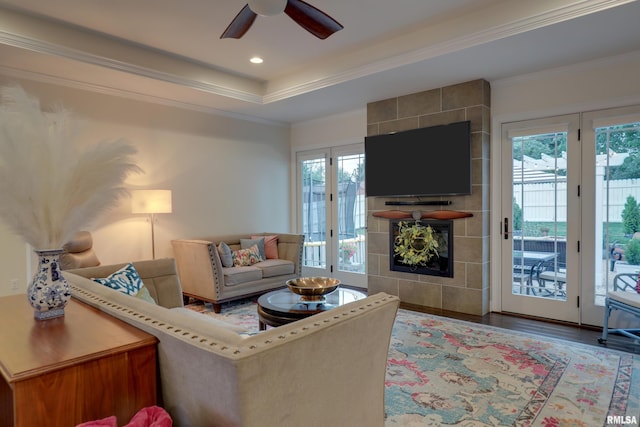 3005 Helens Ct, Quincy, IL 62305 - living area with a fireplace, plenty of natural light, ornamental molding, ceiling fan, and wood finished floors