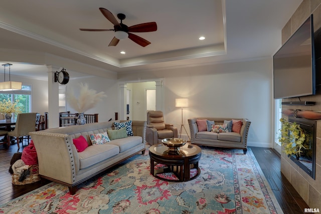 3005 Helens Ct, Quincy, IL 62305 - living area with decorative columns, ceiling fan, hardwood / wood-style flooring, a raised ceiling, and crown molding