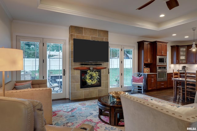3005 Helens Ct, Quincy, IL 62305 - living area with dark wood-type flooring, a raised ceiling, a ceiling fan, crown molding, and recessed lighting