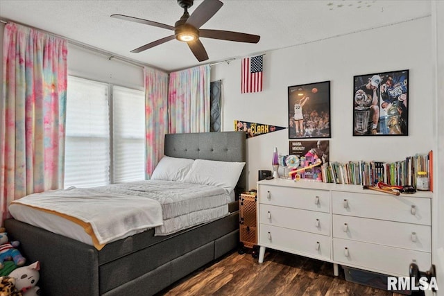 749 E Andrew Rd, Springfield, IL 62707 - bedroom with dark wood-type flooring, a textured ceiling, and ceiling fan