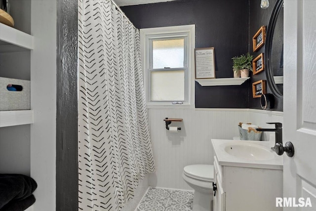 749 E Andrew Rd, Springfield, IL 62707 - bathroom featuring a wainscoted wall, vanity, and tile patterned floors