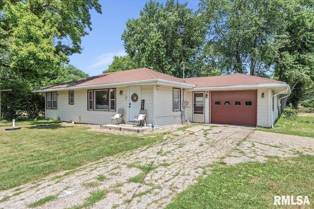 749 E Andrew Rd, Springfield, IL 62707 - ranch-style house featuring a garage, driveway, and a front lawn
