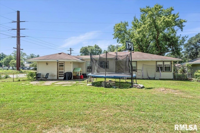 749 E Andrew Rd, Springfield, IL 62707 - back of house with a trampoline and a yard