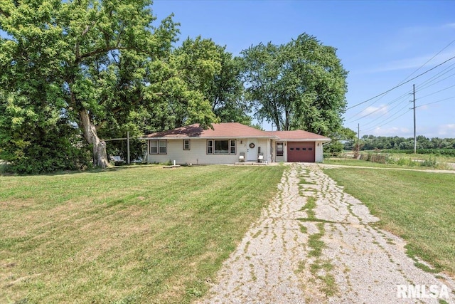 749 E Andrew Rd, Springfield, IL 62707 - ranch-style house with an attached garage, driveway, and a front lawn