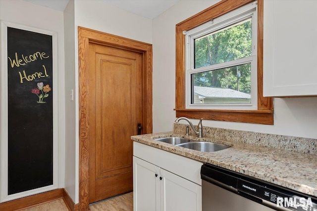 1529 W Reed Ave, Springfield, IL 62704 - kitchen with stainless steel dishwasher, light stone countertops, white cabinetry, and light wood-style flooring
