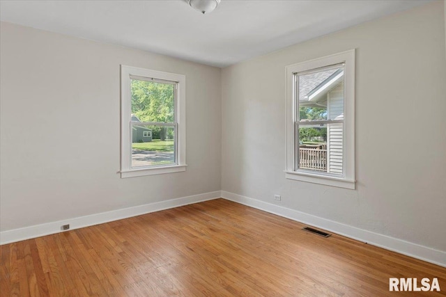 1529 W Reed Ave, Springfield, IL 62704 - empty room with baseboards and light wood finished floors