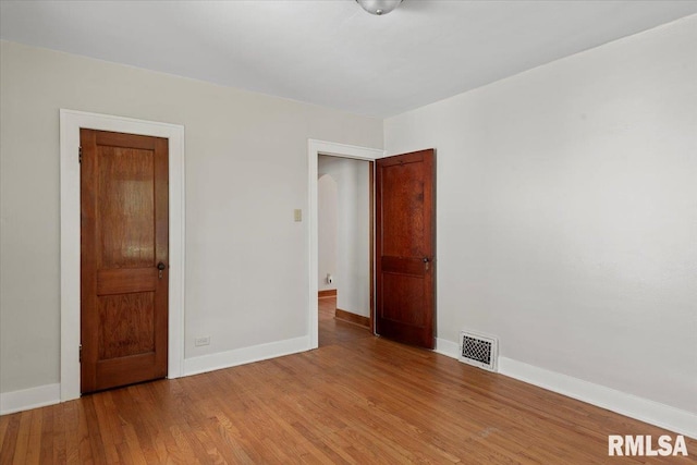 1529 W Reed Ave, Springfield, IL 62704 - spare room with baseboards and light wood-style flooring