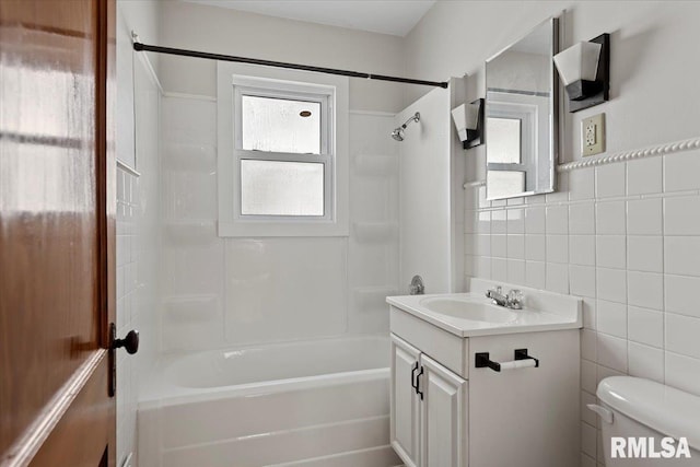 1529 W Reed Ave, Springfield, IL 62704 - bathroom with tile walls, vanity, and washtub / shower combination