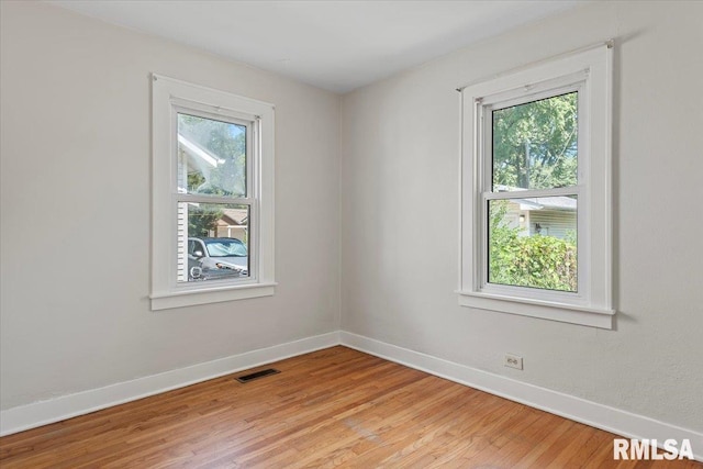 1529 W Reed Ave, Springfield, IL 62704 - unfurnished room with baseboards and light wood-style flooring